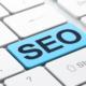 A white keyboard with one bright blue key labeled "SEO." Do you know which keys to press to get your therapy practice ranking higher in search results? SEO for therapists means having the right strategy so that ideal clients can find you with ease.