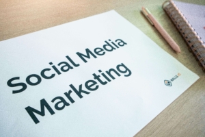 "Social media marketing" on white paper. Social media can help therapists enhance their online presence through educational posts. Learn more from a social media manager here!