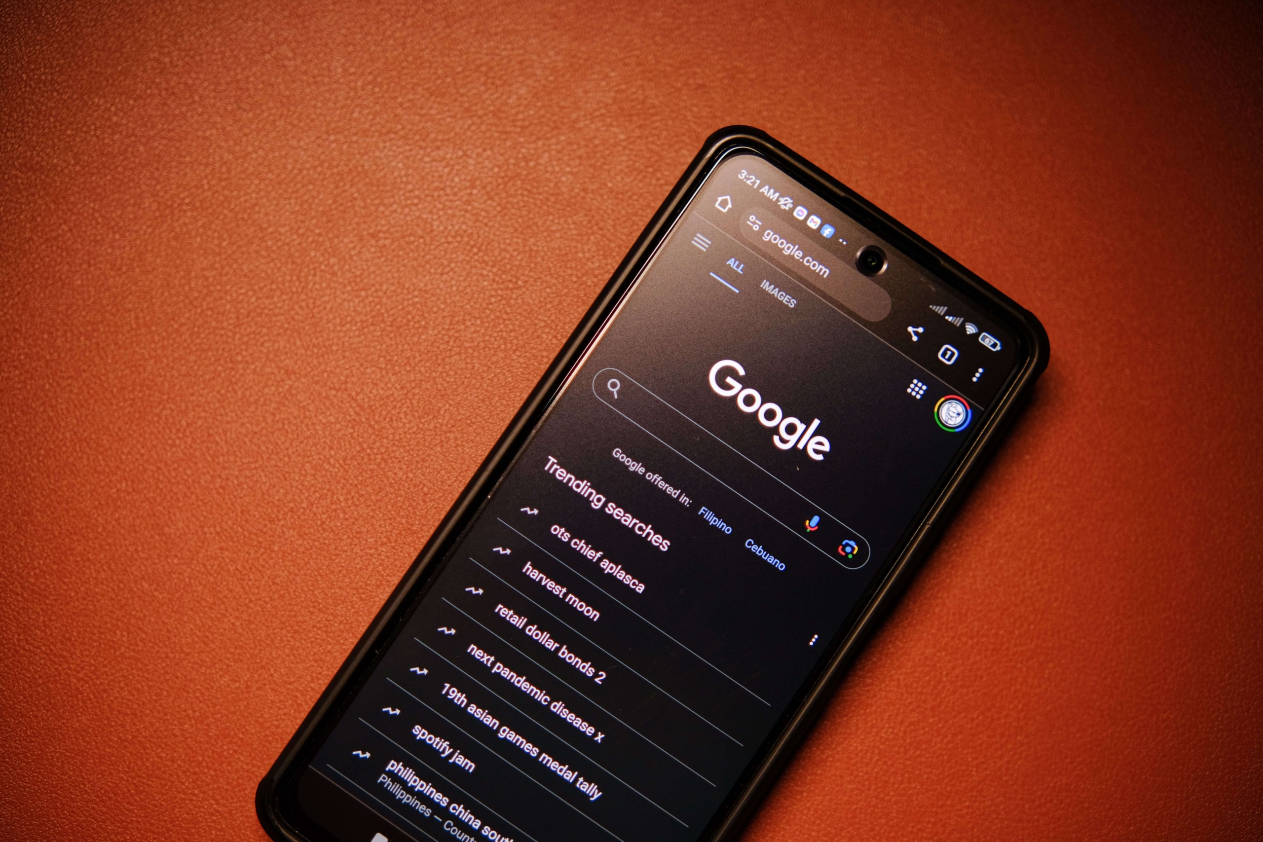 A smartphone displays Google search results and trending online topics. Can strategic blogging improve how easily prospective clients find your practice through search engines? Seo services for therapists can strengthen your online presence and authority.