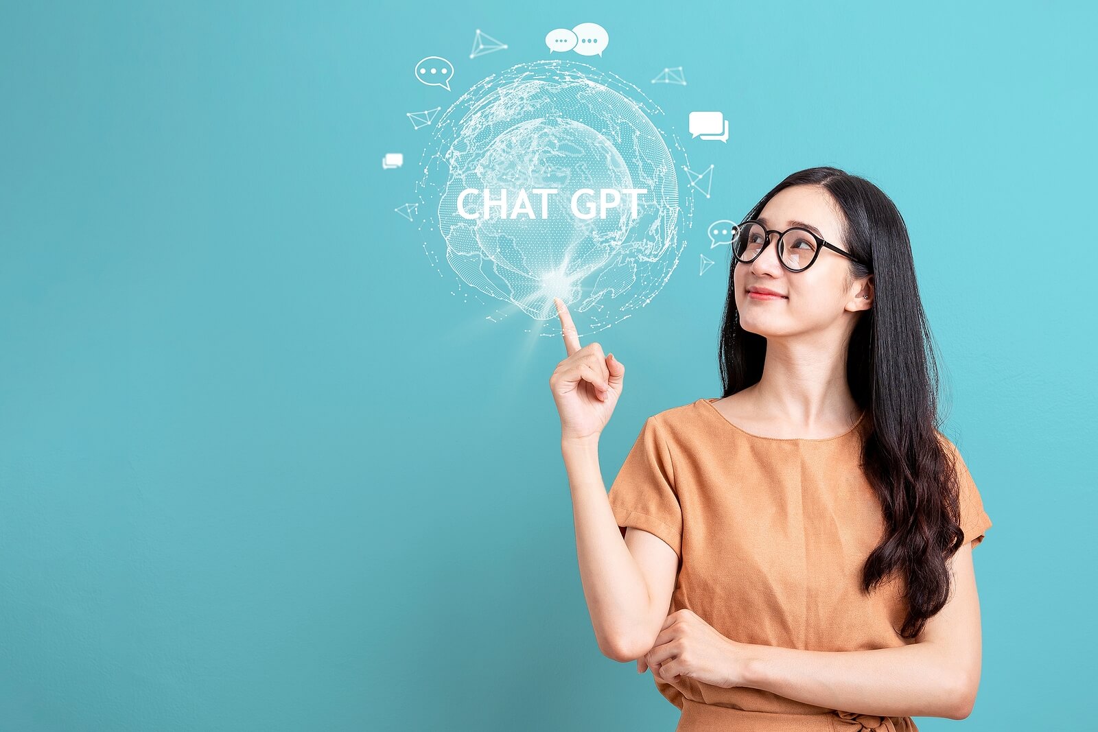 A woman wearing glasses points toward a digital graphic reading "Chat GPT." Could SEO for therapists help your content show up in AI-generated answers? Therapist SEO now includes optimizing for AI tools like ChatGPT, not just search engines.