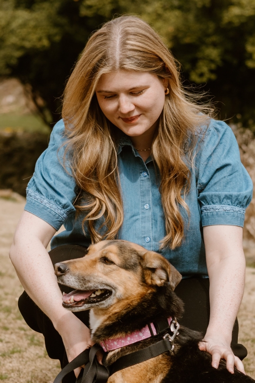 Search Visibility Specialist petting her dog, representing personalized SEO guidance and support for improving online visibility.