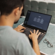 A man types a question into ChatGPT on his laptop, illustrating how quickly AI can generate confident-sounding responses. For therapists and helping professionals investing in SEO for mental health, understanding the difference between AI confidence and AI accuracy is an essential part of building a content strategy that actually serves your practice.