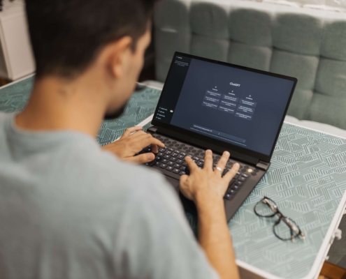 A man types a question into ChatGPT on his laptop, illustrating how quickly AI can generate confident-sounding responses. For therapists and helping professionals investing in SEO for mental health, understanding the difference between AI confidence and AI accuracy is an essential part of building a content strategy that actually serves your practice.