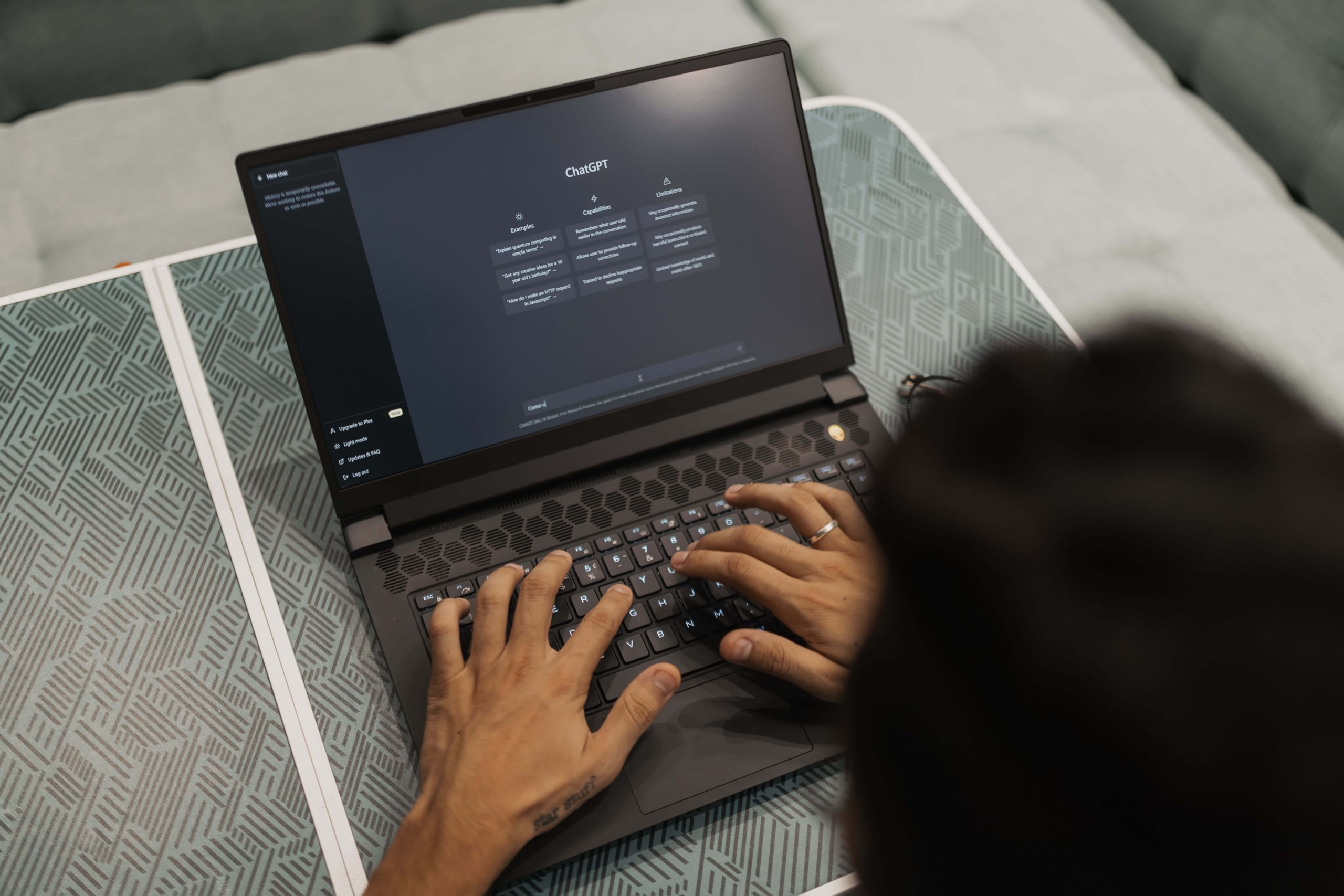 Person using ChatGPT on a laptop, highlighting how AI tools interact with useful, authoritative content online.